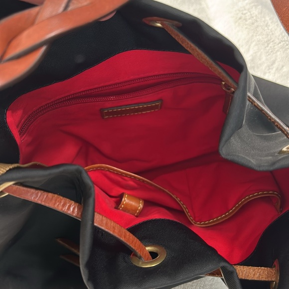 Pre-owned nylon Dooney & Burke black purse. It has a pretty red interior. - Picture 3 of 3